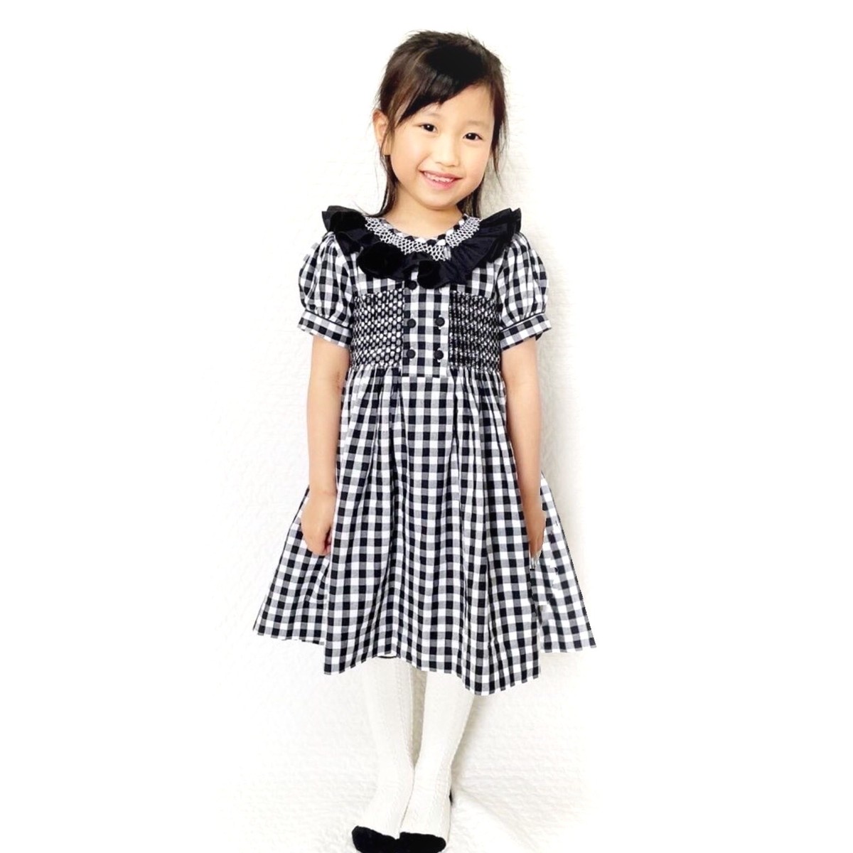スモッキングワンピース ブラックチェック フロント 包みボタン Heart Spring スモッキングワンピースと可愛い子供服