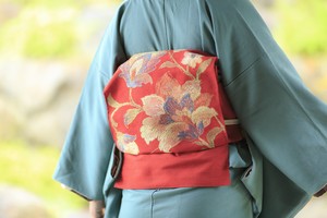 赤い紬地に花柄 名古屋帯 赤い紬地に花柄 名古屋帯