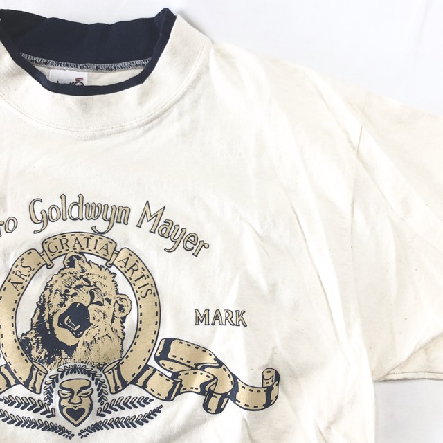 Mgm Metro Goldwyn Mayer ライオン ロゴtシャツ 半袖 生成り ネイビー 映画 都町の古着屋 Charkha Bazaar チャルカバザール