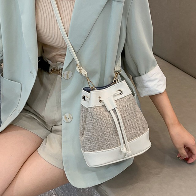 巾着バッグ 可愛い かごバッグシンプル カバン 斜め掛け 巾着型 かごバッグ レディース ショルダーバッグ 春夏 ストローバッグ 小さめ 斜め掛けバッグ ネット通販 購入 激安 10代 代 30代 40代 春 夏 Roprot ロプロット ファッション レディースアパレル販売